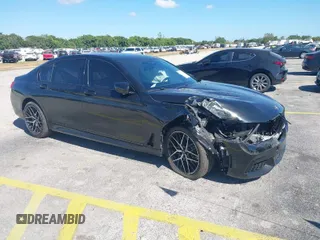 2016 BMW 7 Series 740i with VIN WBA7E2C51GG738889, listed as a IAAI auction lot 41838071 with 49,649 mi miles. Bid and sale history available at carsss.com. Image 1.