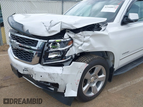 2020 Chevrolet Tahoe LT with VIN 1GNSCBKC4LR181887, listed as a IAAI auction lot 42160821 with 106,757 mi miles and . Bid and sale history available at DreamBid. Image 6.