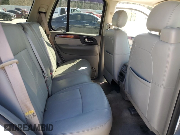 2006 GMC Envoy Denali with VIN 1GKET63M762190296, listed as a Copart auction lot 46691595 with 128,985 mi miles and Salvage Title. Bid and sale history available at carsss.com. Image 10.