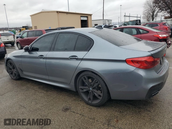 2018 BMW 5 Series M550i xDrive with VIN WBAJB9C54JB286707, listed as a Copart auction lot 49158435 with 74,307 mi miles and Salvage title. Bid and sale history available at DreamBid. Image 2.