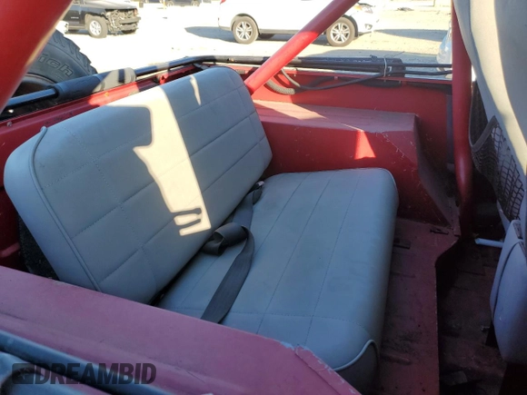 1991 Jeep Wrangler z VIN 2J4FY19P6MJ107521, wystawiony jako Copart lot #84077214 z przebiegiem 1 311 216 mil mil oraz Czysty tytuł • Clean title. Historia ofert i sprzedaży dostępna na DreamBid. Obrazek 10.