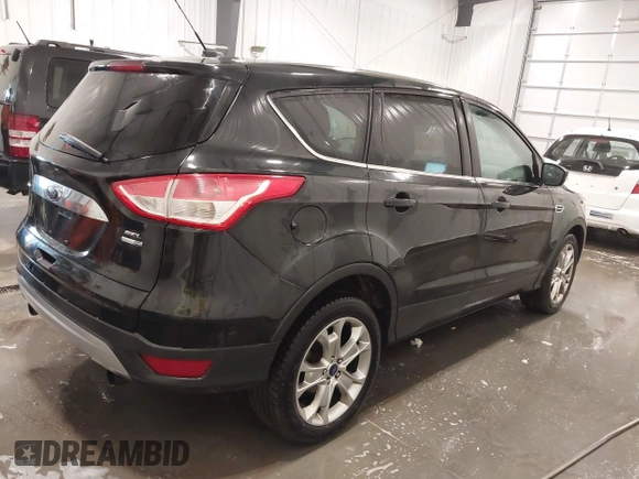 2013 Ford Escape SEL with VIN 1FMCU9H99DUD11347, listed as a IAAI auction lot 41758824 with 154,339 mi miles. Bid and sale history available at carsss.com. Image 4.