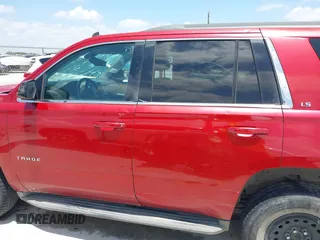 2015 Chevrolet Tahoe LS with VIN 1GNSCAEC4FR121571, listed as a IAAI auction lot 42499156 with 131,284 mi miles and . Bid and sale history available at DreamBid. Image 14.