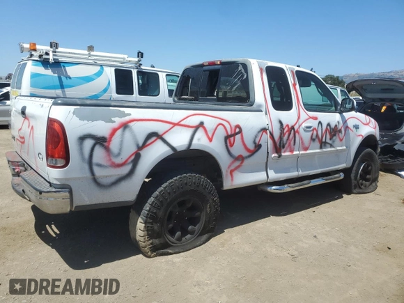 1999 Ford F-150 with VIN 1FTZX1727XKA70271, listed as a Copart auction lot 58016095 with 219,093 mi miles and Salvage title. Bid and sale history available at DreamBid. Image 3.