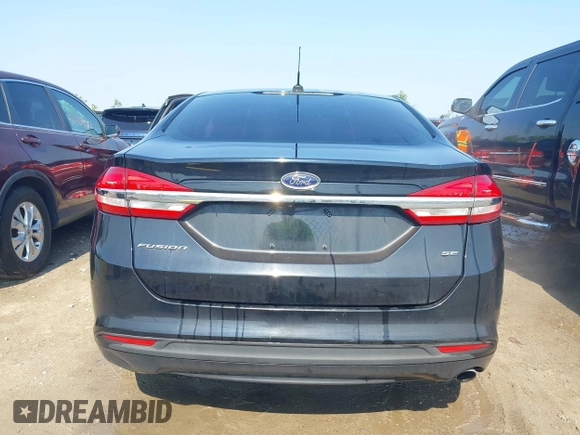 2017 Ford Fusion SE z VIN 3FA6P0H71HR135111, wystawiony jako IAAI lot #42454080 z przebiegiem 120 355 mil mil oraz . Historia ofert i sprzedaży dostępna na DreamBid. Obrazek 16.