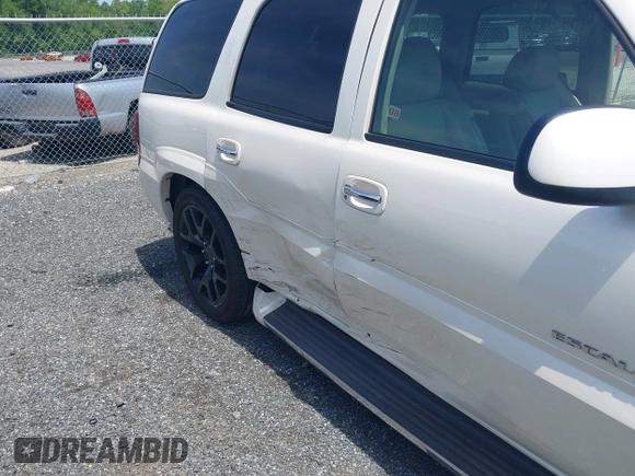 2003 Cadillac Escalade z VIN 1GYEK63N43R222254, wystawiony jako IAAI lot #42228127 z przebiegiem 167 294 mil mil oraz . Historia ofert i sprzedaży dostępna na DreamBid. Obrazek 6.