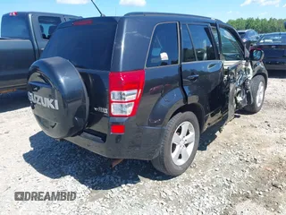 2009 Suzuki Grand Vitara z VIN JS3TE047094100192, wystawiony jako IAAI lot #42336959 z przebiegiem 244 995 mil mil oraz . Historia ofert i sprzedaży dostępna na DreamBid. Obrazek 4.