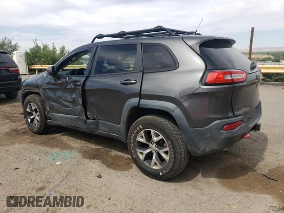 2014 Jeep Cherokee Trailhawk with VIN 1C4PJMBS6EW140981, listed as a Copart auction lot 58260325 with 97,036 mi miles and Salvage title. Bid and sale history available at DreamBid. Image 2.