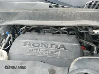 2014 Honda Pilot Touring with VIN 5FNYF4H97EB051760, listed as a IAAI auction lot 43329833 with 220,273 mi miles and . Bid and sale history available at DreamBid. Image 20.