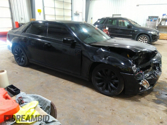 2014 Chrysler 300 S with VIN 2C3CCABG2EH343503, listed as a IAAI auction lot 40934463 with 128,876 mi miles and . Bid and sale history available at carsss.com. Image 1.