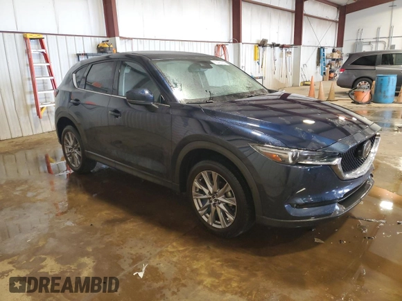 2020 Mazda CX-5 Grand Touring with VIN JM3KFBDM1L0860873, listed as a Copart auction lot 55463335 with 85,810 mi miles and Salvage Title. Bid and sale history available at DreamBid. Image 4.