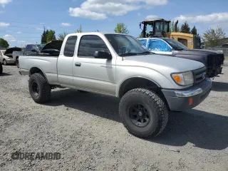2000 Toyota Tacoma with VIN 5TEWN72N8YZ717707, listed as a Copart auction lot 54479455 with 197,407 mi miles and Salvage title. Bid and sale history available at DreamBid. Image 4.