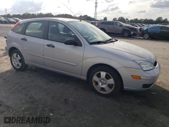 2007 Ford Focus S with VIN 1FAHP37N67W268162, listed as a Copart auction lot 71736384 with 69,391 mi miles and Salvage Title. Bid and sale history available at DreamBid. Image 4.