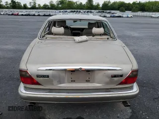 1995 Jaguar XJ with VIN SAJHX174XSC738856, listed as a Copart auction lot 57768915 with Not provided miles and Salvage title. Bid and sale history available at DreamBid. Image 6.