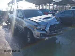 2018 Toyota Tacoma SR with VIN 5TFCZ5AN3JX151479, listed as a IAAI auction lot 41428376 with 104,717 mi miles. Bid and sale history available at carsss.com. Image 1.