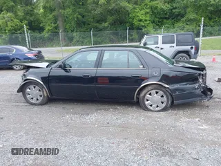 2002 Cadillac DeVille DTS z VIN 1G6KF579320288667, wystawiony jako IAAI lot #42331236 z przebiegiem 71 189 mil mil oraz . Historia ofert i sprzedaży dostępna na DreamBid. Obrazek 14.