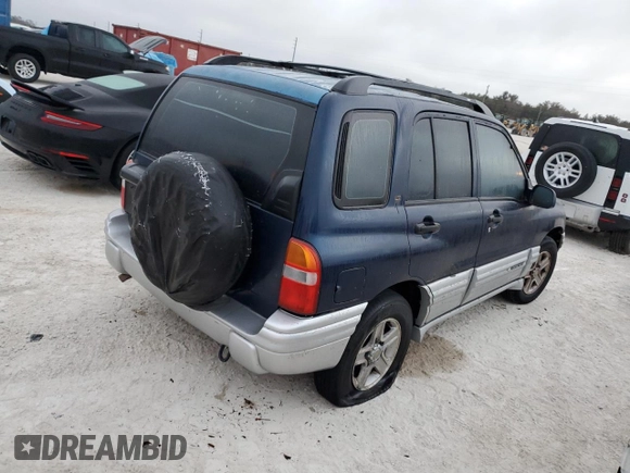 2002 Chevrolet Tracker LT with VIN 2CNBE634126928532, listed as a Copart auction lot 76990704 with Not provided miles and Salvage title. Bid and sale history available at DreamBid. Image 3.