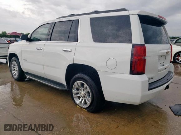 2016 Chevrolet Tahoe LT with VIN 1GNSCBKC2GR475679, listed as a Copart auction lot 54987195 with 130,387 mi miles and Salvage title. Bid and sale history available at DreamBid. Image 2.