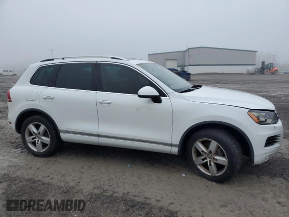 2012 Volkswagen Touareg Sport with VIN WVGEF9BP2CD010668, listed as a Copart auction lot 55306485 with 166,255 mi miles and Clean Title. Bid and sale history available at DreamBid. Image 4.