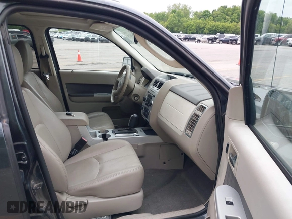2009 Mercury Mariner Premier z VIN 4M2CU87759KJ17765, wystawiony jako IAAI lot #42354423 z przebiegiem 163 907 mil mil oraz . Historia ofert i sprzedaży dostępna na DreamBid. Obrazek 5.