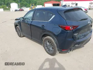 2021 Mazda CX-5 Touring z VIN JM3KFBCMXM0389857, wystawiony jako IAAI lot #42309650 z przebiegiem 49 938 mil mil oraz . Historia ofert i sprzedaży dostępna na DreamBid. Obrazek 3.