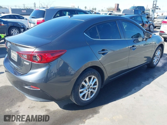 2016 Mazda Mazda3 i Grand Touring with VIN JM1BM1X79G1278079, listed as a IAAI auction lot 42010729 with 104,797 mi miles. Bid and sale history available at carsss.com. Image 4.