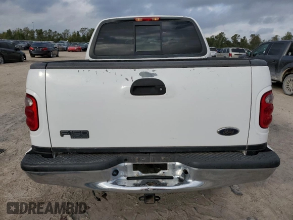 2001 Ford F-150 XLT with VIN 1FTRW07L01KC60815, listed as a Copart auction lot 87022424 with 205,304 mi miles and Salvage title. Bid and sale history available at DreamBid. Image 6.