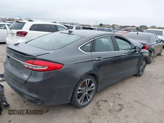 2017 Ford Fusion Titanium with VIN 3FA6P0K93HR416160, listed as a IAAI auction lot 41636451 with 100,383 mi miles. Bid and sale history available at carsss.com. Image 4.