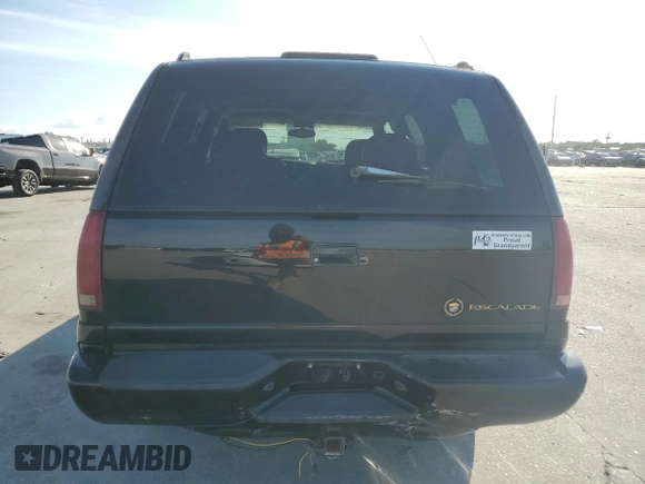2000 Cadillac Escalade z VIN 1GYEK13R0YR167895, wystawiony jako Copart lot #82586443 z przebiegiem 267 099 mil mil oraz Szkoda całkowita • Salvage title. Historia ofert i sprzedaży dostępna na DreamBid. Obrazek 6.