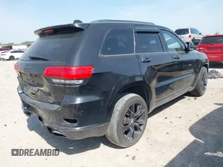 2015 Jeep Grand Cherokee Summit with VIN 1C4RJFJM1FC867861, listed as a IAAI auction lot 42034207 with 92,205 mi miles and . Bid and sale history available at DreamBid. Image 4.