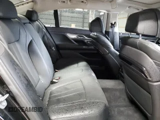 2019 BMW 7 Series 740i z VIN WBA7E2C57KB454012, wystawiony jako Copart lot #50977775 z przebiegiem Nie podano mil oraz Szkoda całkowita • Salvage title. Historia ofert i sprzedaży dostępna na DreamBid. Obrazek 11.