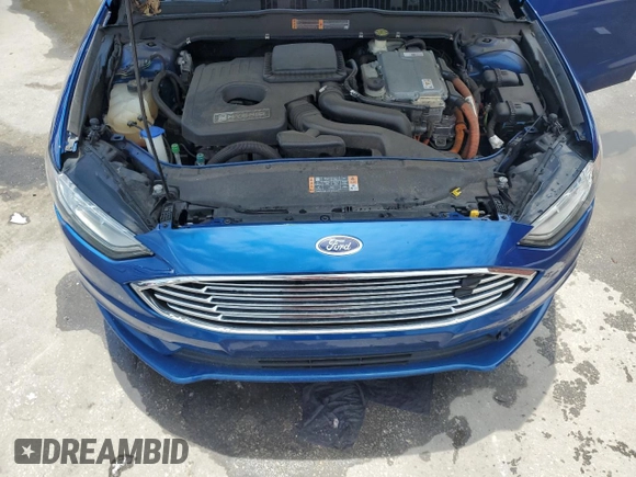 2017 Ford Fusion Hybrid SE z VIN 3FA6P0LU6HR319103, wystawiony jako Copart lot #58494695 z przebiegiem 104 483 mil mil oraz Szkoda całkowita • Salvage title. Historia ofert i sprzedaży dostępna na DreamBid. Obrazek 11.