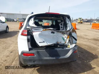 2014 Jeep Cherokee Latitude with VIN 1C4PJMCB1EW301011, listed as a IAAI auction lot 41777745 with 133,643 mi miles and . Bid and sale history available at DreamBid. Image 16.