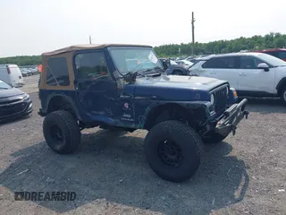 2006 Jeep Wrangler Sport z VIN 1J4FA49S66P708332, wystawiony jako IAAI lot #42402995 z przebiegiem 130 795 mil mil oraz . Historia ofert i sprzedaży dostępna na DreamBid. Obrazek 13.