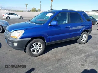 2005 Kia Sportage LX with VIN KNDJF723457057402, listed as a IAAI auction lot 41471742 with 215,565 mi miles and . Bid and sale history available at carsss.com. Image 6.