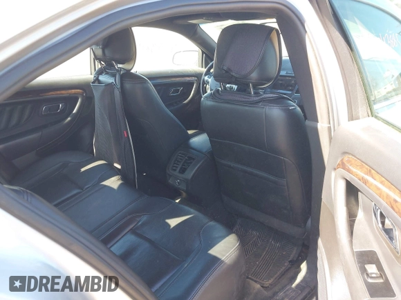 2013 Ford Taurus Limited z VIN 1FAHP2F85DG114828, wystawiony jako IAAI lot #42043885 z przebiegiem 166 786 mil mil oraz . Historia ofert i sprzedaży dostępna na DreamBid. Obrazek 8.