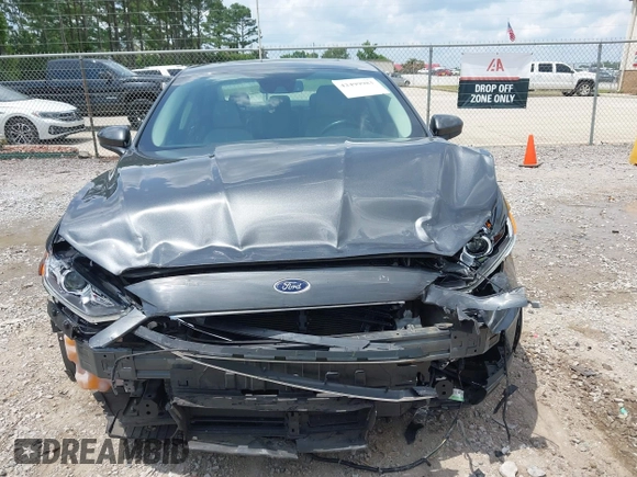 2020 Ford Fusion SE z VIN 3FA6P0HD6LR160147, wystawiony jako IAAI lot #42499983 z przebiegiem 73 971 mil mil oraz . Historia ofert i sprzedaży dostępna na DreamBid. Obrazek 13.