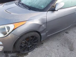 2012 Hyundai Veloster w/Gray Int z VIN KMHTC6AD1CU082872, wystawiony jako IAAI lot #41980406 z przebiegiem 132 804 mil mil oraz . Historia ofert i sprzedaży dostępna na DreamBid. Obrazek 6.