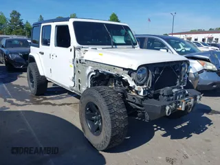 2018 Jeep Wrangler Unlimited Sahara z VIN 1C4HJXEG4JW106111, wystawiony jako IAAI lot #41994833 z przebiegiem 99 583 mil mil oraz . Historia ofert i sprzedaży dostępna na DreamBid. Obrazek 1.