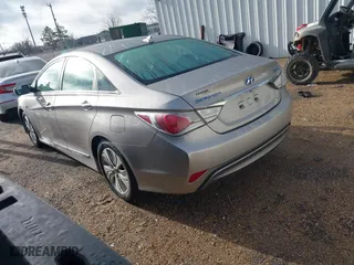 2013 Hyundai Sonata Hybrid with VIN KMHEC4A41DA092477, listed as a IAAI auction lot 41453656 with 124,804 mi miles. Bid and sale history available at carsss.com. Image 3.