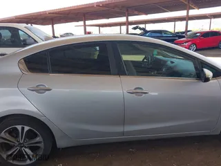 2016 Kia Forte EX with VIN KNAFX4A8XG5598156, listed as a IAAI auction lot 41980015 with 114,672 mi miles. Bid and sale history available at carsss.com. Image 12.