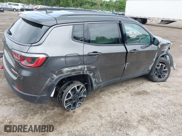 2020 Jeep Compass Trailhawk with VIN 3C4NJDDB3LT200268, listed as a IAAI auction lot 42250192 with 73,804 mi miles and . Bid and sale history available at DreamBid. Image 4.