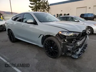 2024 BMW X6 xDrive40i with VIN 5UX33EX04R9T50214, listed as a Copart auction lot 85332204 with 8,710 mi miles and Salvage Title. Bid and sale history available at carsss.com. Image 4.
