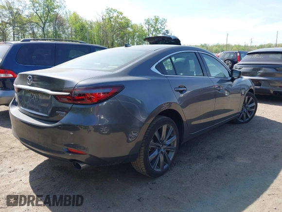 2021 Mazda 6 Grand Touring with VIN JM1GL1TY4M1600534, listed as a IAAI auction lot 42012560 with Not Provided miles. Bid and sale history available at carsss.com. Image 4.