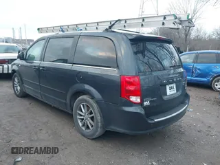 2014 Dodge Grand Caravan SXT with VIN 2C4RDGCG8ER257837, listed as a IAAI auction lot 41211629 with 139,231 mi miles and . Bid and sale history available at DreamBid. Image 3.