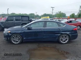 2020 Ford Fusion SEL z VIN 3FA6P0CD9LR183400, wystawiony jako IAAI lot #42271491 z przebiegiem 52 020 mil mil oraz . Historia ofert i sprzedaży dostępna na DreamBid. Obrazek 17.