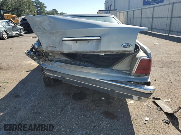 1989 Ford Crown Victoria z VIN 2FABP74F2KX141884, wystawiony jako Copart lot #74934494 z przebiegiem 84 761 mil mil oraz Szkoda całkowita • Salvage title. Historia ofert i sprzedaży dostępna na DreamBid. Obrazek 6.