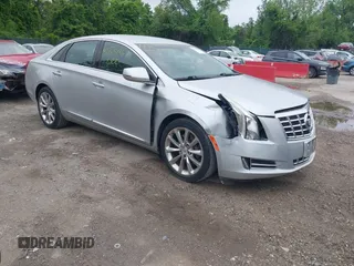 2014 Cadillac XTS Luxury z VIN 2G61N5S37E9269204, wystawiony jako IAAI lot #42145436 z przebiegiem 120 600 mil mil oraz . Historia ofert i sprzedaży dostępna na DreamBid. Obrazek 1.