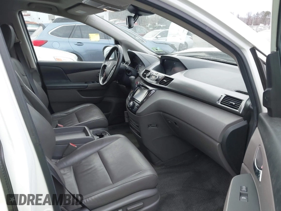 2014 Honda Odyssey Touring with VIN 5FNRL5H94EB001479, listed as a IAAI auction lot 41123678 with 147,269 mi miles and . Bid and sale history available at carsss.com. Image 5.