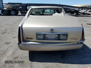 1995 Cadillac DeVille z VIN 1G6KD52B6SU274827, wystawiony jako Copart lot #41902125 z przebiegiem Nie podano mil oraz Szkoda całkowita • Salvage title. Historia ofert i sprzedaży dostępna na DreamBid. Obrazek 6.
